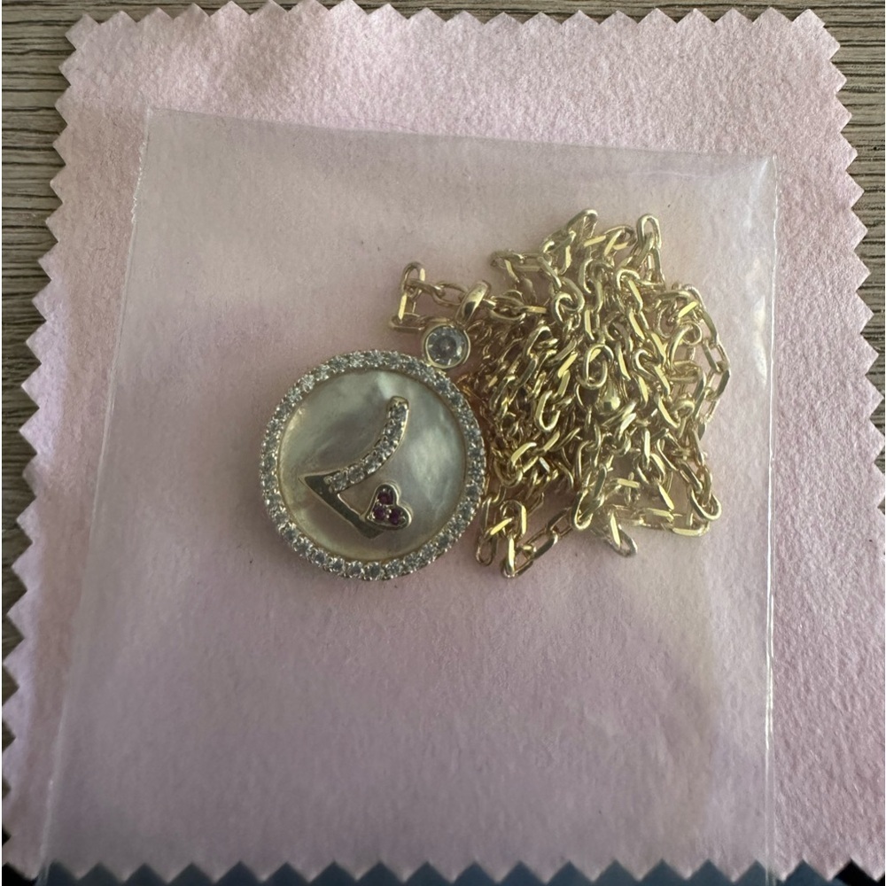 Letter “L” with heart jewelry. New